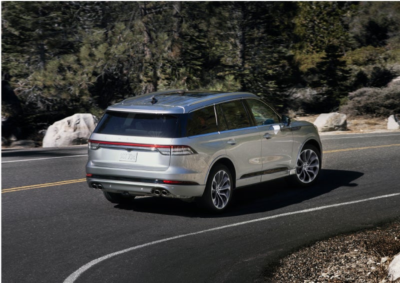 A Lincoln Aviator® is being driven on a winding road | Dan Cummins Lincoln in Nicholasville KY