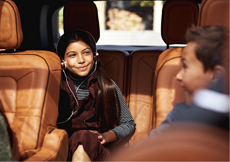 Two young people are comfortably seated in the second and third rows of a Lincoln Aviator® SUV | Dan Cummins Lincoln in Nicholasville KY