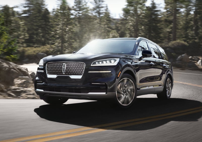 A Lincoln Aviator® SUV is being driven on a winding mountain road | Dan Cummins Lincoln in Nicholasville KY