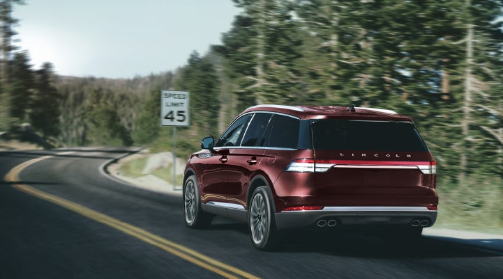 A 2024 Lincoln Aviator® SUV is being driven on a winding mountain road | Dan Cummins Lincoln in Nicholasville KY