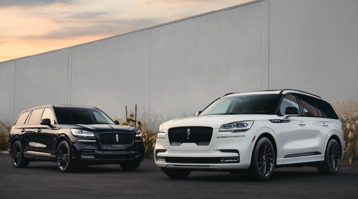 Two Lincoln Aviator® SUVs are shown with the available Jet Appearance Package | Dan Cummins Lincoln in Nicholasville KY