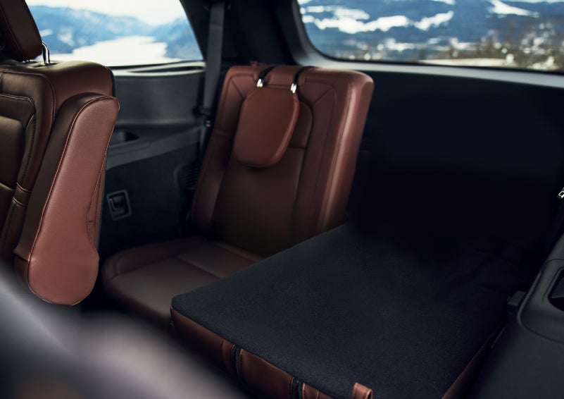 The left rear seat of a 2024 Lincoln Aviator® SUV is shown folded flat for additional cargo space | Dan Cummins Lincoln in Nicholasville KY