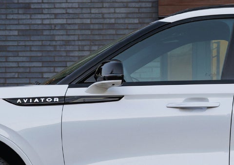 The driver’s side door and fender badging of a white 2026 Lincoln Aviator® SUV are showcased. | Dan Cummins Lincoln in Nicholasville KY