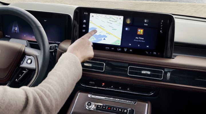 A person is tapping the center display touchscreen of a 2026 Lincoln Aviator® SUV. | Dan Cummins Lincoln in Nicholasville KY