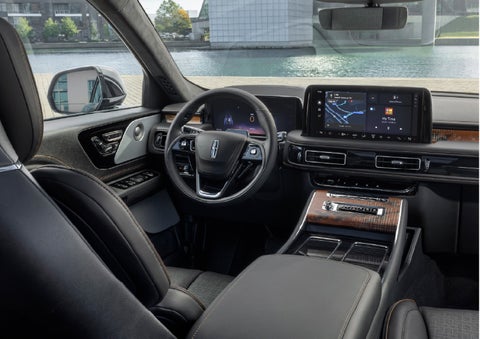 The interior of the 2026 Lincoln Aviator® SUV is shown parked with a view of a harbor through the windshield. | Dan Cummins Lincoln in Nicholasville KY