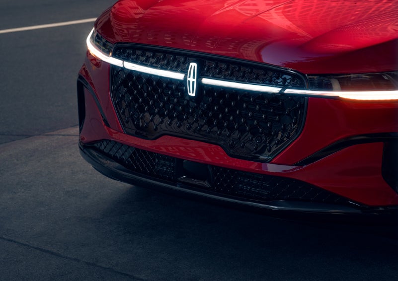 The available front LED light bar and center Lincoln Star logo glow at dusk. | Dan Cummins Lincoln in Nicholasville KY