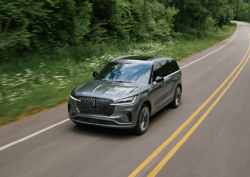 A 2027 Lincoln Aviator® SUV is being driven down a road. | Dan Cummins Lincoln in Nicholasville KY