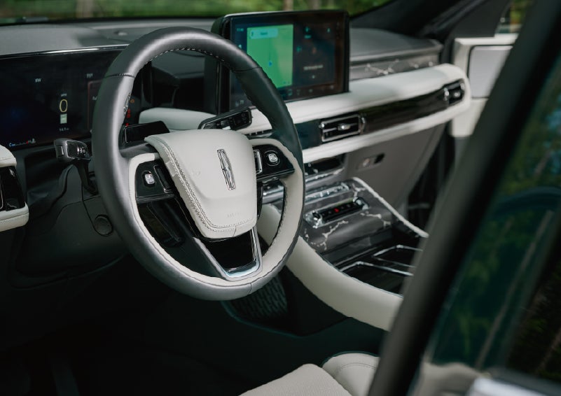 The leather-trimmed steering wheel of a 2027 Lincoln Aviator® Black Label™ SUV. | Dan Cummins Lincoln in Nicholasville KY