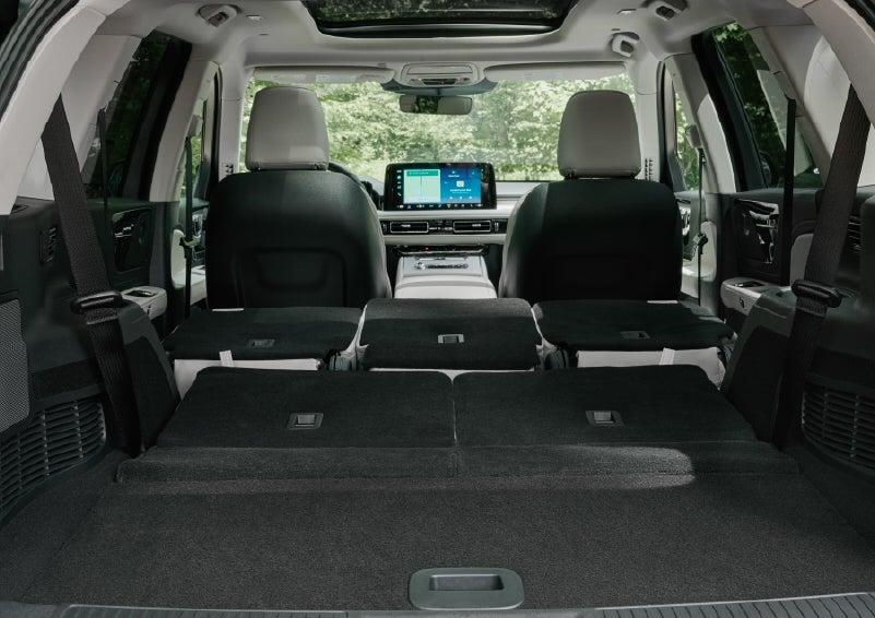 A rear to front view of the interior of a 2027 Lincoln Aviator® Black Label™ SUV shows the third and second rows folded flat | Dan Cummins Lincoln in Nicholasville KY